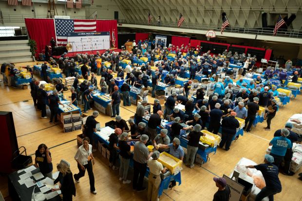 More than 1,300 volunteers joined together to pack meals for...