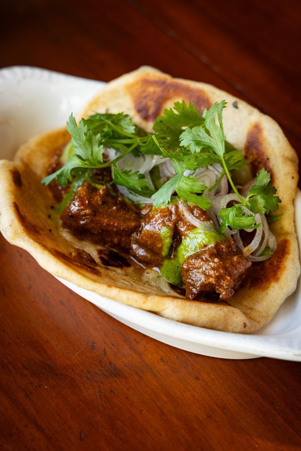 The braised Ojai lamb tikka naan from The Dutchess is...
