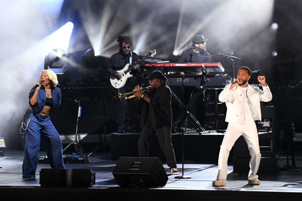 John Legend and members of his band take the stage...