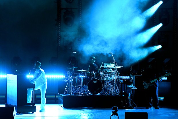 John Legend plays the piano while performing at the Hollywood...