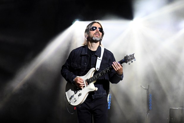 Guitarist Ben O’Neill plays with John Legend during his concert...