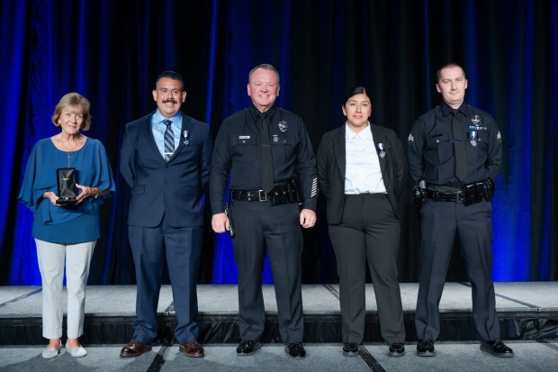 LAPD Purple Heart Awardees, L to R; Nancy Riley, accepting for her husband Phillip Riley, Officer Anthony Diaz, Chief Jim McDonnell, presenter, Officer Melissa Salinas, and, officer Joseph Gall. (Photo by David Crane, Los Angeles Daily News/SCNG)