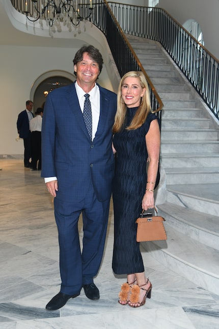Blair Pogue, left, with his wife, Cristin, at a party at 4400 Belfort Place.