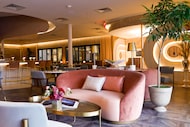 Seating options range from intimate two-top tables to couches and round booths at champagne...