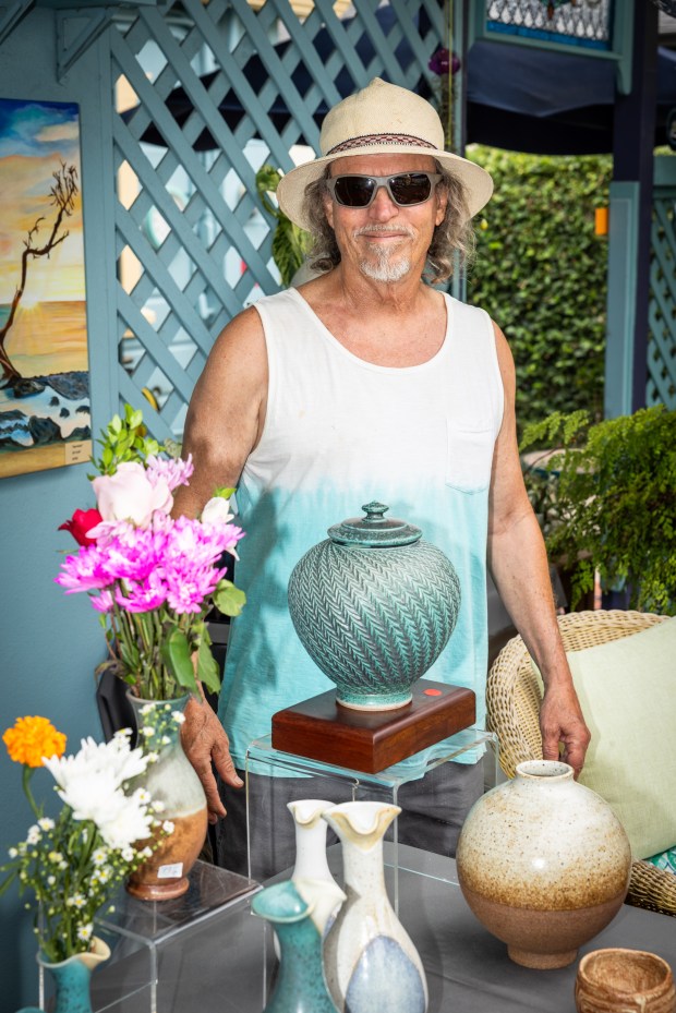 Isauro “Izzy” Elizondo with his artwork. (Milan Kovacevic)