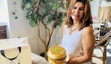 Pastry chef Zena Demirceviren with a cheesesteak at her shop By Zena at 41 E. Main St. in Moorestown on Aug. 29, 2025.