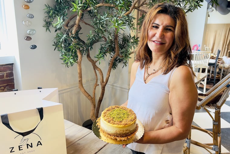Pastry chef Zena Demirceviren with a cheesesteak at her shop By Zena at 41 E. Main St. in Moorestown on Aug. 29, 2025.