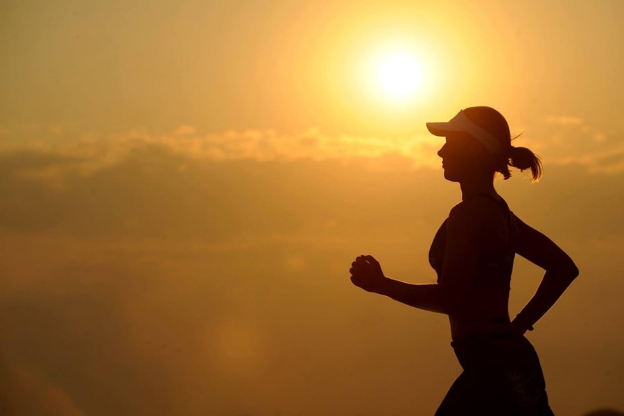 woman jogging outside in the morning