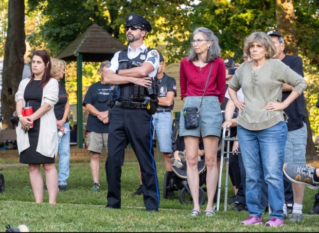 Attendees were invited to hold lighted candles as a symbol of hope and renewal during the ceremony.. (Photo by Rick Cawley)