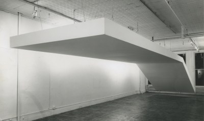 A large white sculpture suspended from the ceiling.