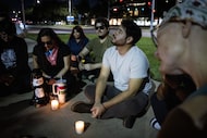 Azael Alvarez shares a personal story in a prayer circle at a vigil outside of Parkland...