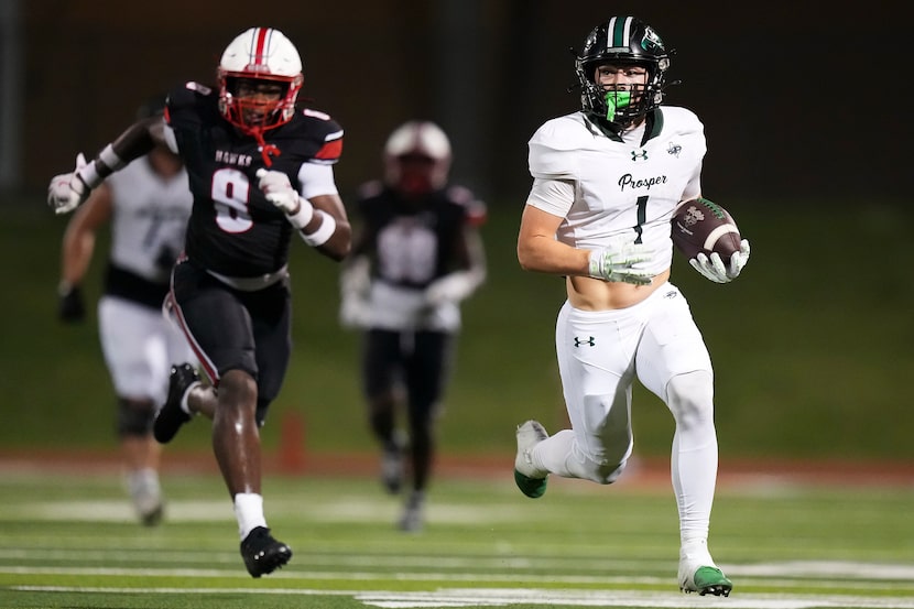 Prosper wide receiver Lathon Latiolais (1) gets past Rockwall-Heath linebacker Landon Foster...