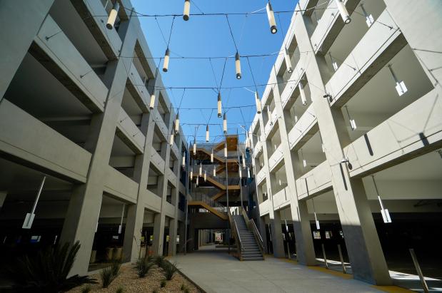 A walkway and stairs and hanging lights between the parking towers at the Terminal 1 Parking Plaza in the San Diego International Airport on Tuesday, Aug. 20, 2024 in San Diego, California. (Alejandro Tamayo / The San Diego Union-Tribune)