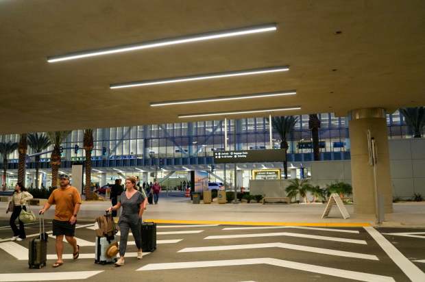 San Diego International Airport will welcome the first flights to arrive at the new Terminal 1. Arriving passengers walking to parking structure San Diego International Airport on Monday, Sept. 22, 2025 in San Diego, California. (Alejandro Tamayo / The San Diego Union-Tribune)