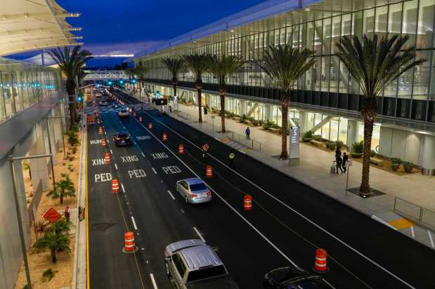 San Diego International Airport will welcome the first flights to arrive at the new Terminal 1. Traffic next to the parking structure and the new Terminal 1 at the San Diego International Airport on Monday, Sept. 22, 2025 in San Diego, California. (Alejandro Tamayo / The San Diego Union-Tribune)
