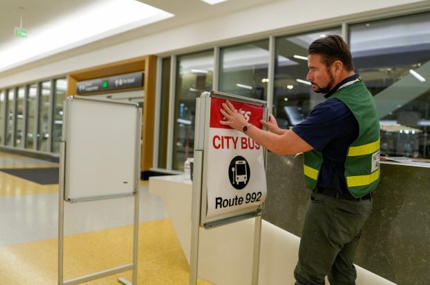San Diego International Airport will welcome the first flights to arrive at the new Terminal 1. Ted Anasis changing signs at the new Terminal 1 at the San Diego International Airport on Monday, Sept. 22, 2025 in San Diego, California. (Alejandro Tamayo / The San Diego Union-Tribune)