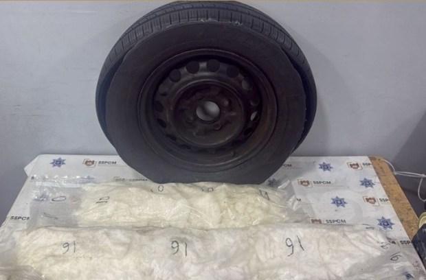 On July 28, a woman reported to the Tijuana police that she had found an unknown spare tire in the trunk of her car. The police found packages of drugs inside the tire. (Tijuana Public Safety Department)