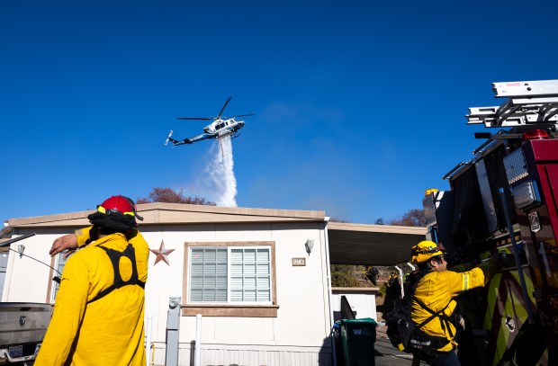 Crews work to put out a fire at Monterey Mobile Lodge that started around 3 p.m. on Monday, Sept. 8, 2025 in Lakeside, CA. (Ana Ramirez / The San Diego Union-Tribune)