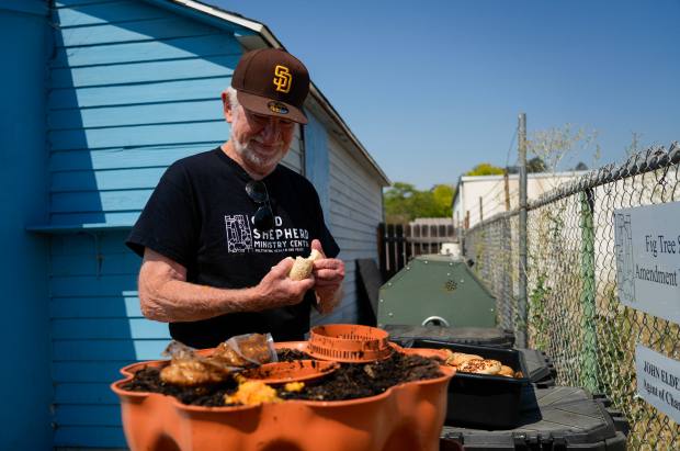 Elder feeds the worm compost at the center. (Alejandro Tamayo...