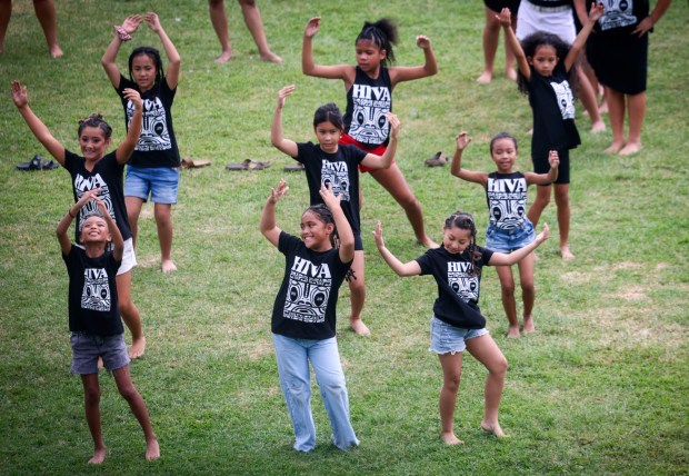 Young members of the HIVA Dance Foundation dance during the Pacific Islander Festival at Ski Beach on Mission Bay on Saturday, Sept. 2025. The festival featrured foodbooths, atras and craftes booths and performers form several Pacific Island Nations. ( Photo by Sandy Huffaker for The San Diego Union-Tribune)