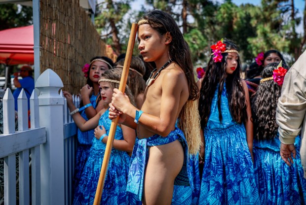 Matua Mantanona prepares to perform with his Chamoro dance group during the Pacific Islander Festival at Ski Beach on Mission Bay on Saturday, Sept. 2025. The festival featrured foodbooths, atras and craftes booths and performers form several Pacific Island Nations. ( Photo by Sandy Huffaker for The San Diego Union-Tribune)