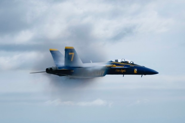 One of the two solo jets from the Navy Blue Angels speeds across the show line center at the Miramar Air Show 2025. The event, which includes vintage aerial aircraft, displays, and immersive experiences, runs through Sunday. (Nelvin C. Cepeda / The San Diego Union-Tribune)