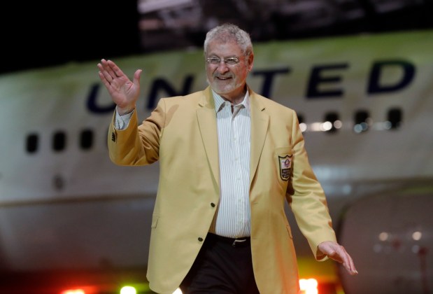 Ron Mix is introduced before the inaugural Pro Football Hall of Fame Fan Fest Friday, May 2, 2014, at the International Exposition Center in Cleveland. (AP Photo/Mark Duncan)