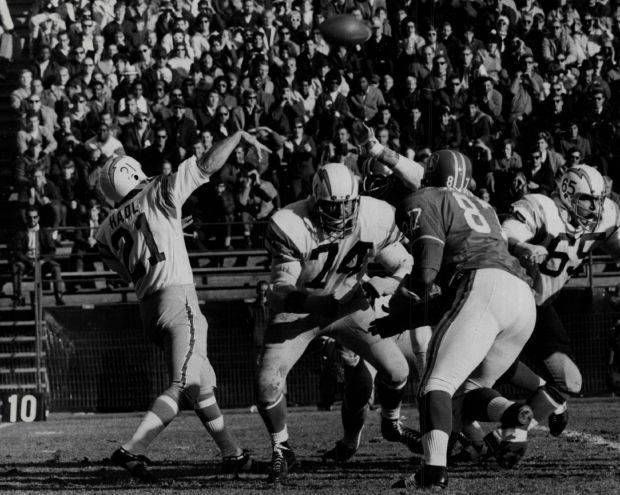 DEC 1 1968, DEC 2 1968Hadl Unloads 79-Yard Bomb To Lance Alworth In First Quarter San Diego quarterback John Hadl gets away a 79-yard, scoring toss to flanker Lance Alworth and receives ample blocking support from Ron Mix (74). Denver's Rich Jackson puts on pressure. Touchdown gave Charges 21-3 lead. Credit: Denver Post