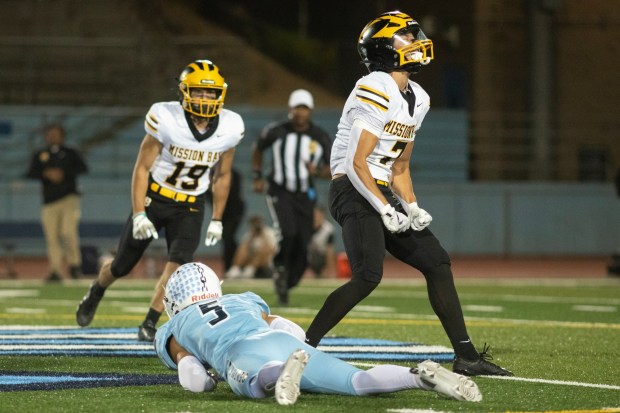 Mission Bay High's, Sean Lander (7) celebrates making the hit against University City High's, Desmond DeMara (5) during Friday's Football game played at University High School in San Diego, CA. (Xavier Hernandez for the UT)