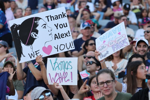 Fans hold signs for Alex Morgan prior to the NWSL match between San Diego Wave and Houston Dash at Snapdragon Stadium on Sept. 07, 2025 in San Diego, California. Morgan, former player of San Diego Wave FC will have her number 13 retired. (Photo by Kevork Djansezian/Getty Images)