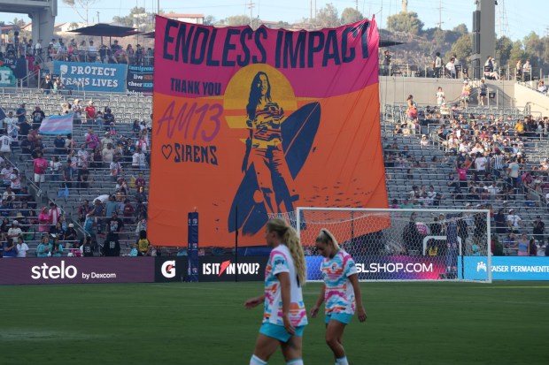 Fans display a large flag for Alex Morgan who will have her number 13 retired during the NWSL match between San Diego Wave and Houston Dash at Snapdragon Stadium on Sept. 07, 2025 in San Diego, California. (Photo by Kevork Djansezian/Getty Images)