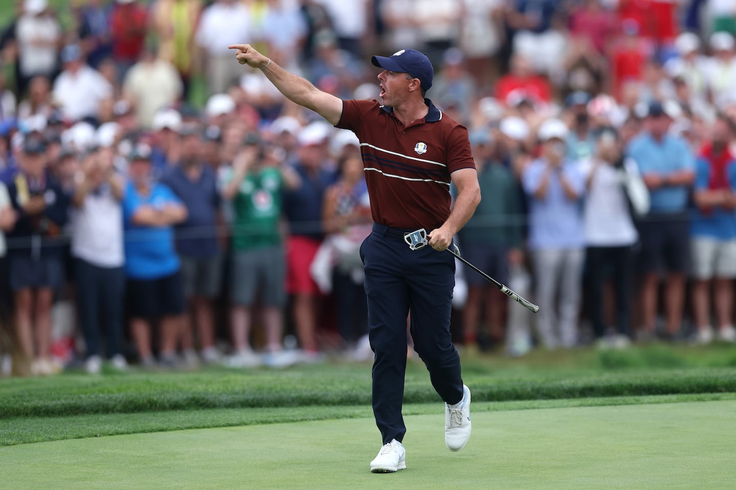 Rory McIlroy of Team Europe yells to the crowd as he walks off the 17th hole green during the Saturday afternoon four-balls matches of the 2025 Ryder Cup.