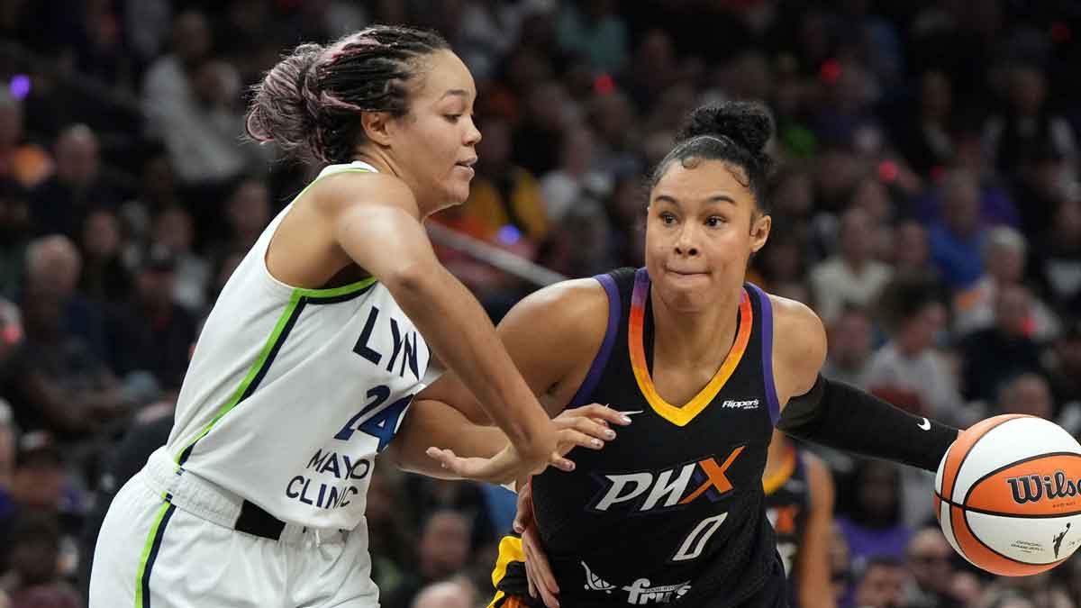 Phoenix Mercury forward Satou Sabally (0) shields the ball from Minnesota Lynx forward Napheesa Collier (24) during game three of the second round for the 2025 WNBA Playoffs at PHX Arena.