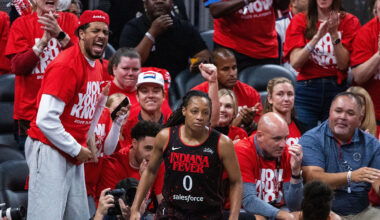 Indiana Fever guard Caitlin Clark (22) and guard Sophie Cunningham (8) on the sideline during game two of round one against the Atlanta Dream for the 2025 WNBA Playoffs at Gainbridge Fieldhouse.