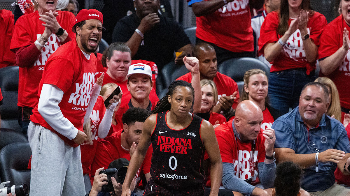 Indiana Fever guard Caitlin Clark (22) and guard Sophie Cunningham (8) on the sideline during game two of round one against the Atlanta Dream for the 2025 WNBA Playoffs at Gainbridge Fieldhouse.
