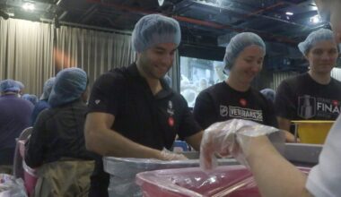 Volunteers pack meals at the Intrepid Museum as part of the 9/11 National Day of Service. (Credit: Mizuki Uchiyama, Tatyana Gonzalez)