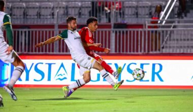 Alameda Post - an Oakland Roots player goes for the ball in a match against Phoenix Rising FC