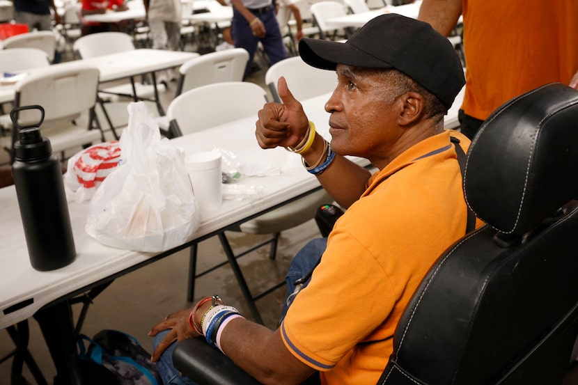 Michael Walton, a guest, thumbs up as speaking to The Dallas Morning News at the Cornerstone...