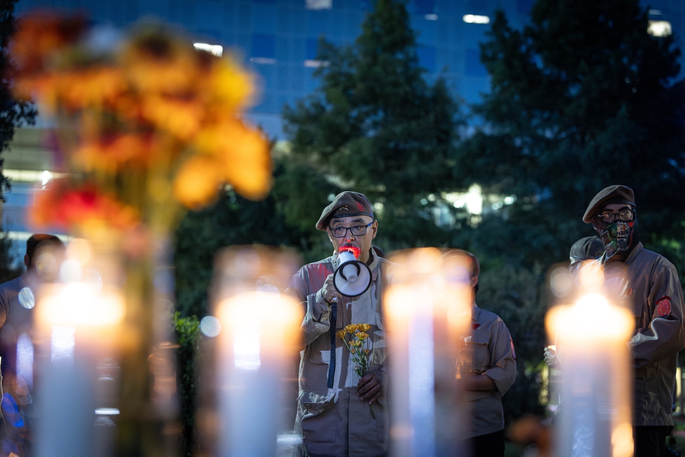 The Brown Berets Regional Commander Tony Rodriguez speaks during a vigil outside of Parkland...
