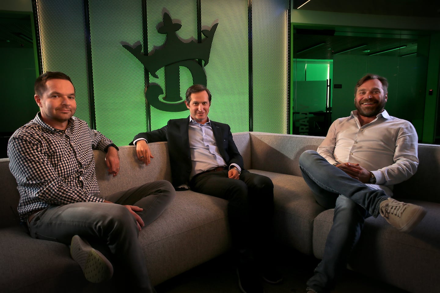 DraftKings cofounders (left to right) Paul Liberman, Jason Robins, and Matt Kalish in the company’s production studio in 2022.
