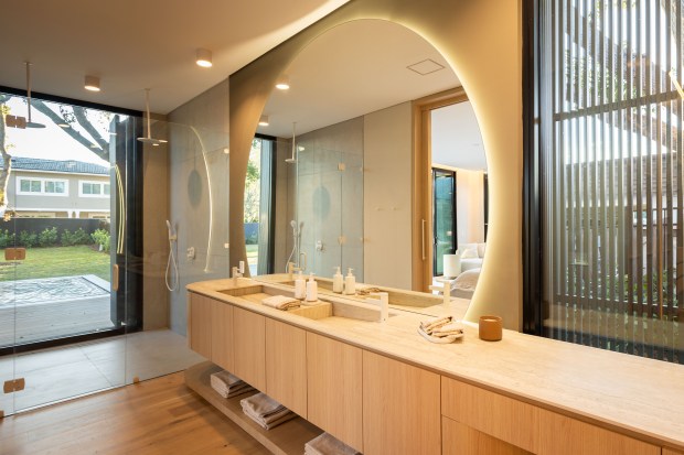 The counters and mirror in the primary bathroom are curved...