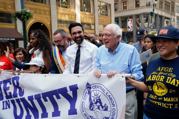 Zohran Mamdani marches with Senator Bernie Sanders in the New York City Labor Day Parade on Sept. 5. 