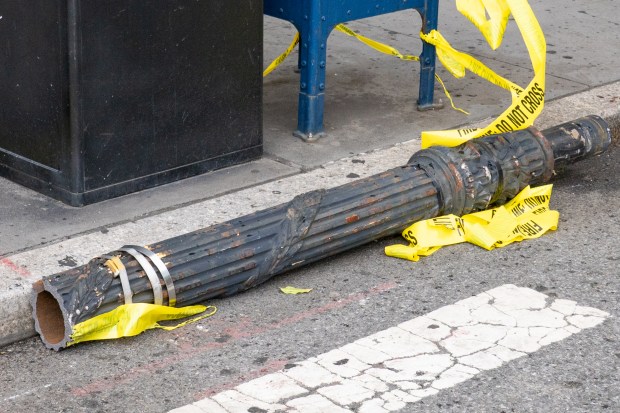A traffic pole at the northwest corner of W. 81st St. and Central Park West in Manhattan toppled on Saturday, Sept. 6, 2025, injuring four people. (Theodore Parisienne / New York Daily News)