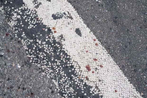 Blood is pictured on the ground after a traffic pole at the northwest corner of W. 81st St. and Central Park West in Manhattan toppled on Saturday, Sept. 6, 2025, injuring four people. (Theodore Parisienne / New York Daily News)
