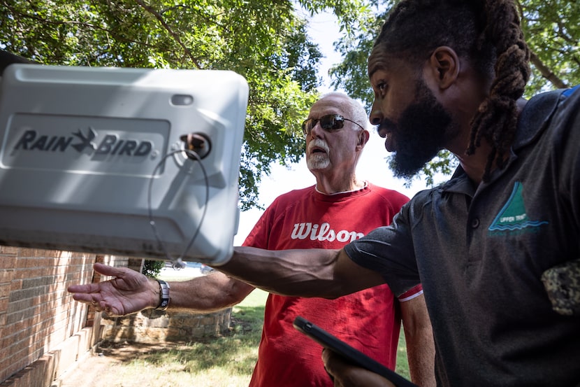 Bob Fulton, left, Fall Brook HOA landscape director, and Quintarus Thomas, an Upper Trinity...