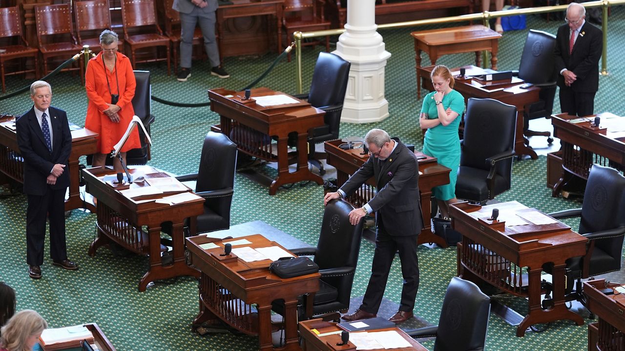 Texas state senators pray before they debate a bill on a redrawn U.S. congressional map during a special session in the Senate Chamber at the Texas Capitol in Austin, Texas, Friday, Aug. 22, 2025. (AP Photo/Eric Gay)