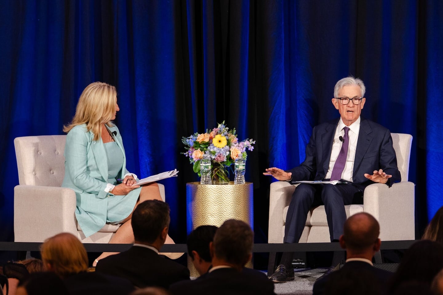 Laurie White, president of the Greater Providence Chamber of Commerce, left, and Jerome Powell, chairman of the US Federal Reserve, during a Greater Providence Chamber of Commerce 2025 Economic Outlook luncheon in Warwick, Rhode Island, US, on Tuesday, Sept. 23, 2025. Powell said the outlooks for the labor market and inflation face risks, reiterating his view that policymakers likely have a difficult road ahead as they weigh further interest-rate cuts. Photographer: Sophie Park/Bloomberg