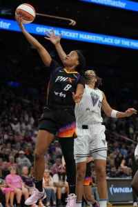 Aug 22, 2025; Phoenix, Arizona, USA; Phoenix Mercury guard Monique Akoa Makani (8) drives past Golden State Valkyries forward Janelle Salaun (13) in the second half at Footprint Center. Mandatory Credit: Rick Scuteri-Imagn Images