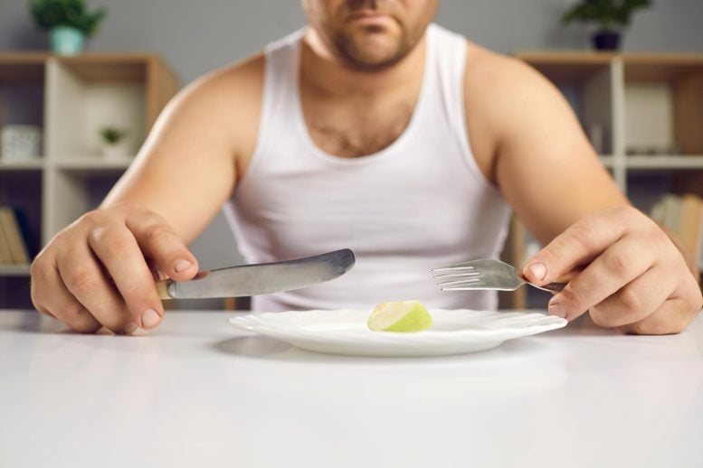 Unhappy Man Dieting Small Portion