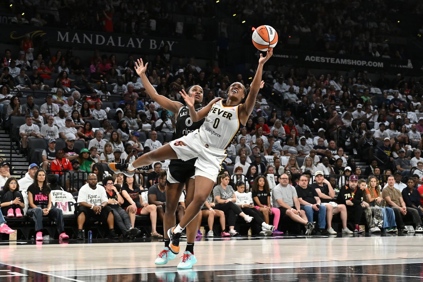 Thanks to a career-playoff-best 34 points from guard Kelsey Mitchell (0), the Indiana Fever shocked the Las Vegas Aces in Game 1 of their WNBA semifinal series.